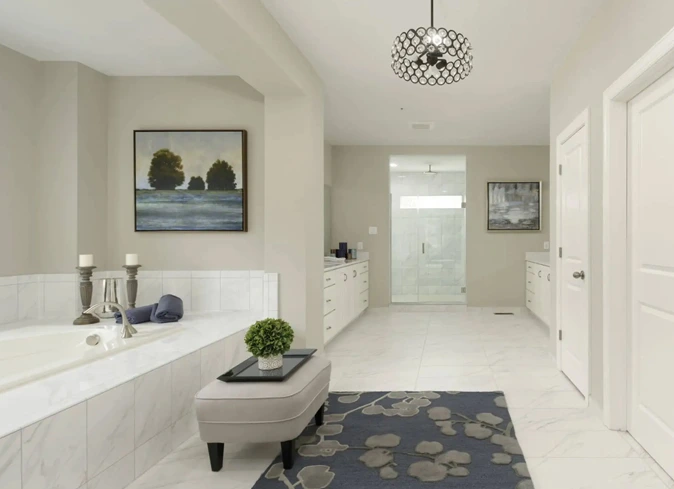 Luxurious bathroom with a big tub, separate shower and pendant lighting