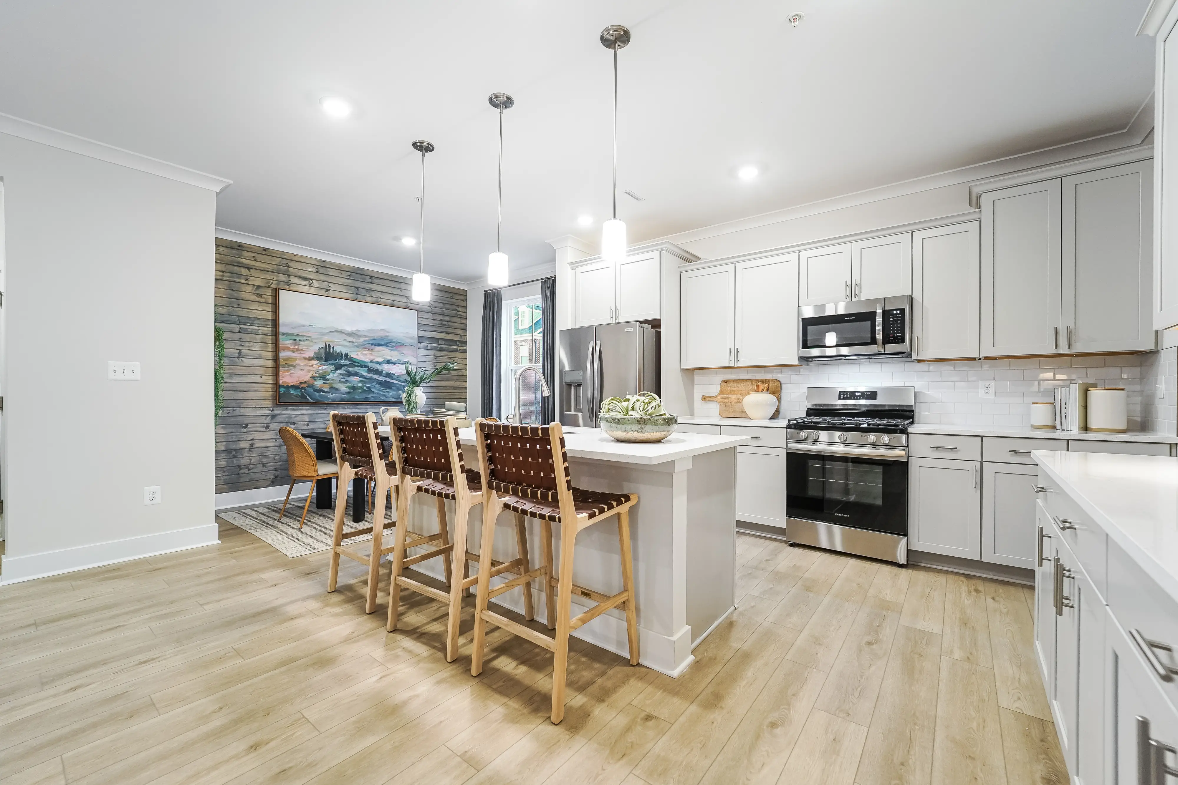 Bright kitchen and open living space with luxury finishes in a Lennar Home at Greenleigh