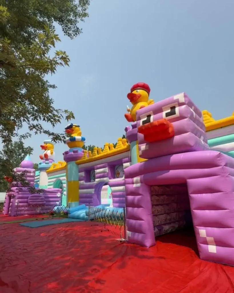 Larger than life inflatable ducks in a fun colorful event space